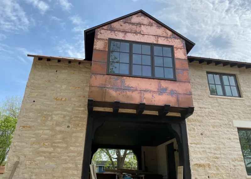 Copper metal panel facade on a stone building for Skylight Installation in Plattekill